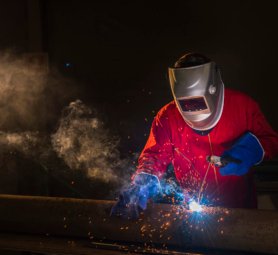 Workshop welder in Red uniform